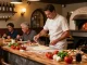 Delicious pizza making process at Pizzeria Madera featuring vibrant ingredients, embodying authentic Italian cuisine and pg soft flavor.